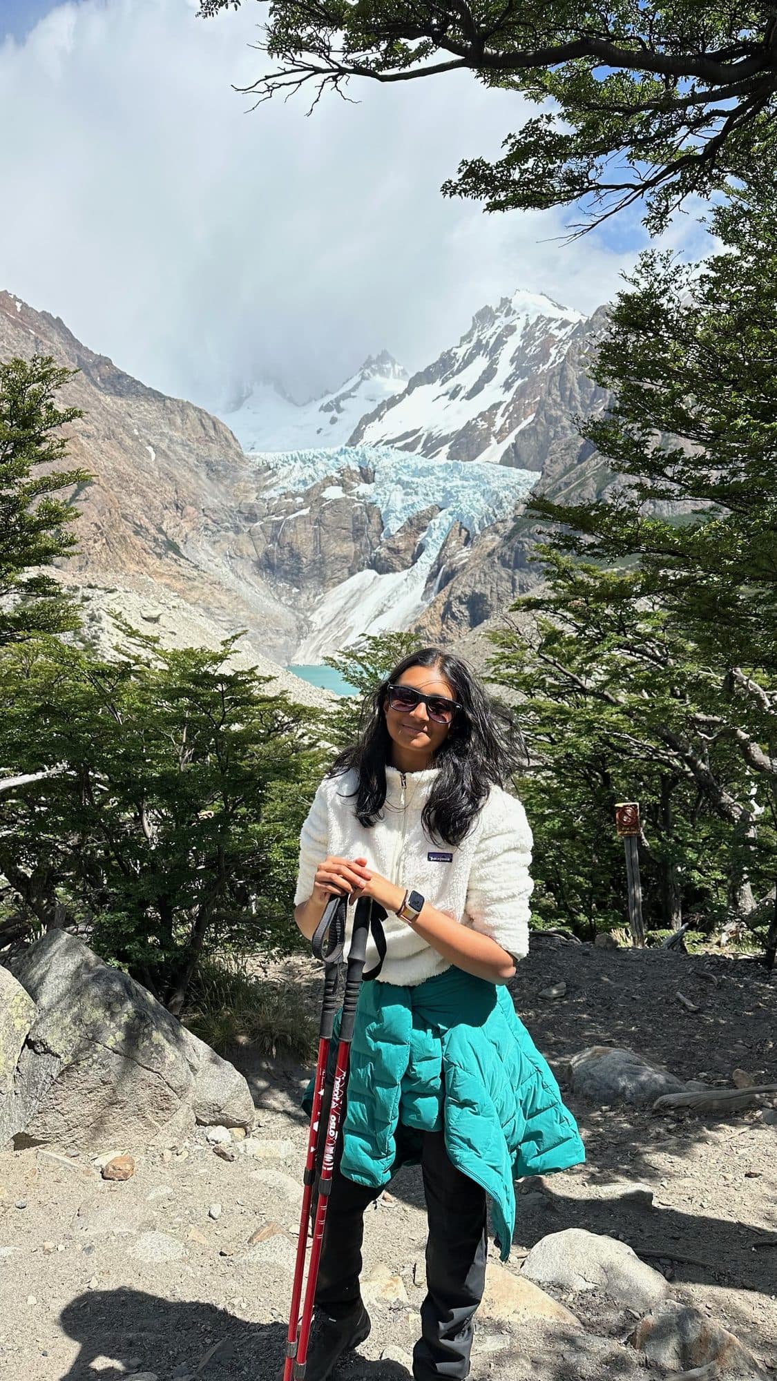 Aanya hiking in front of a glacier in Patagonia