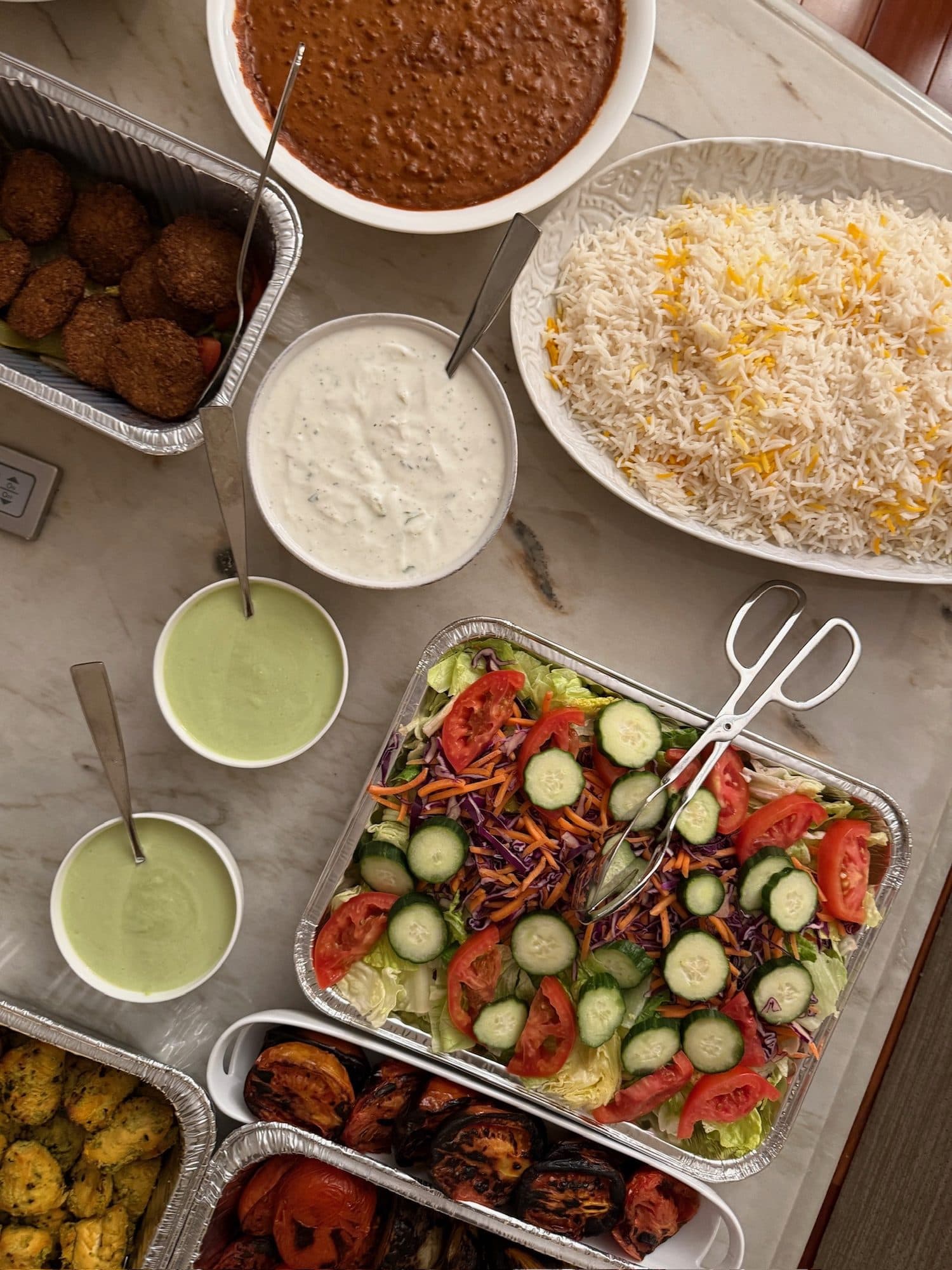 Indian feast with rice, curry, and chutneys